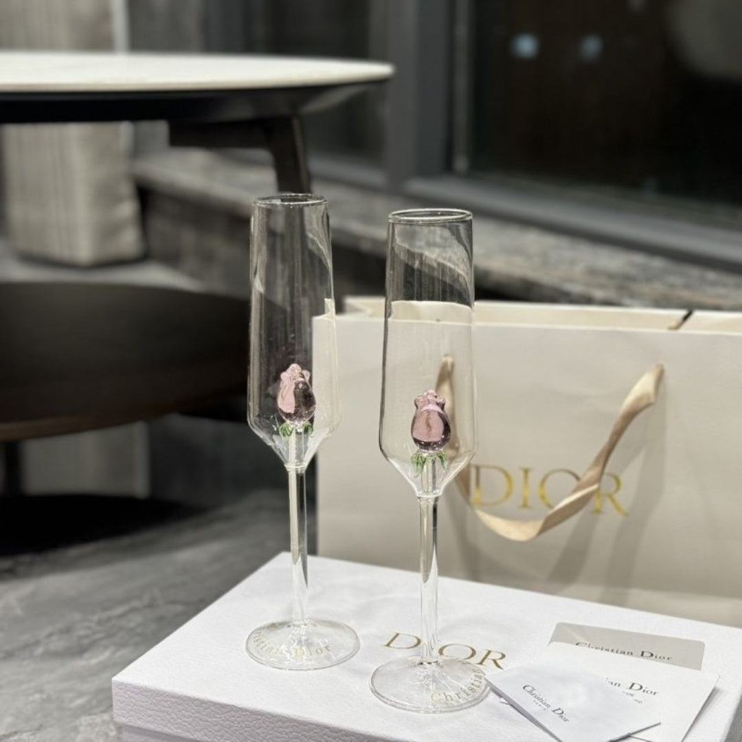 Dior champagne flutes featuring delicate pink rose details