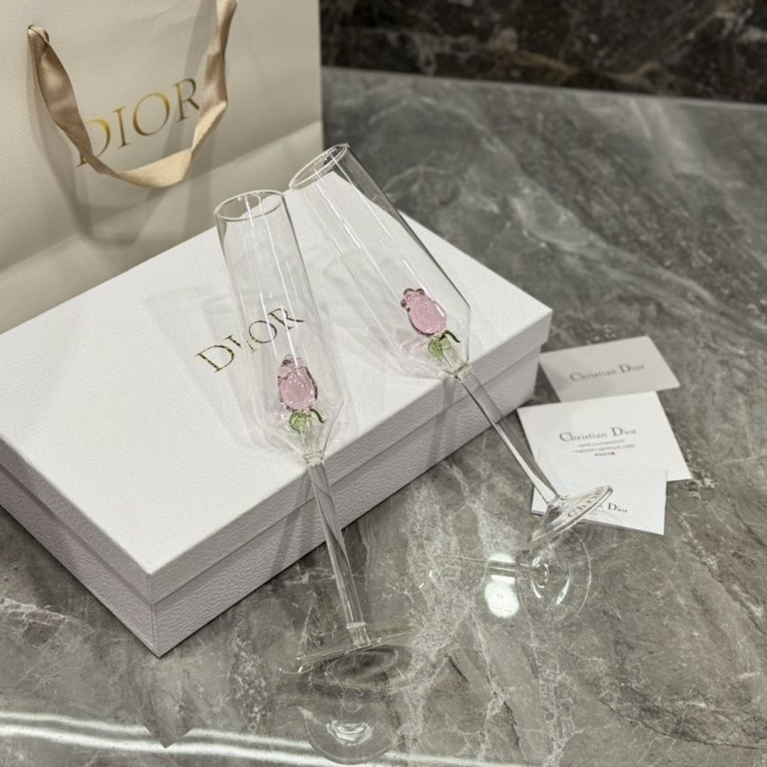 Dior champagne flutes featuring delicate pink rose details
