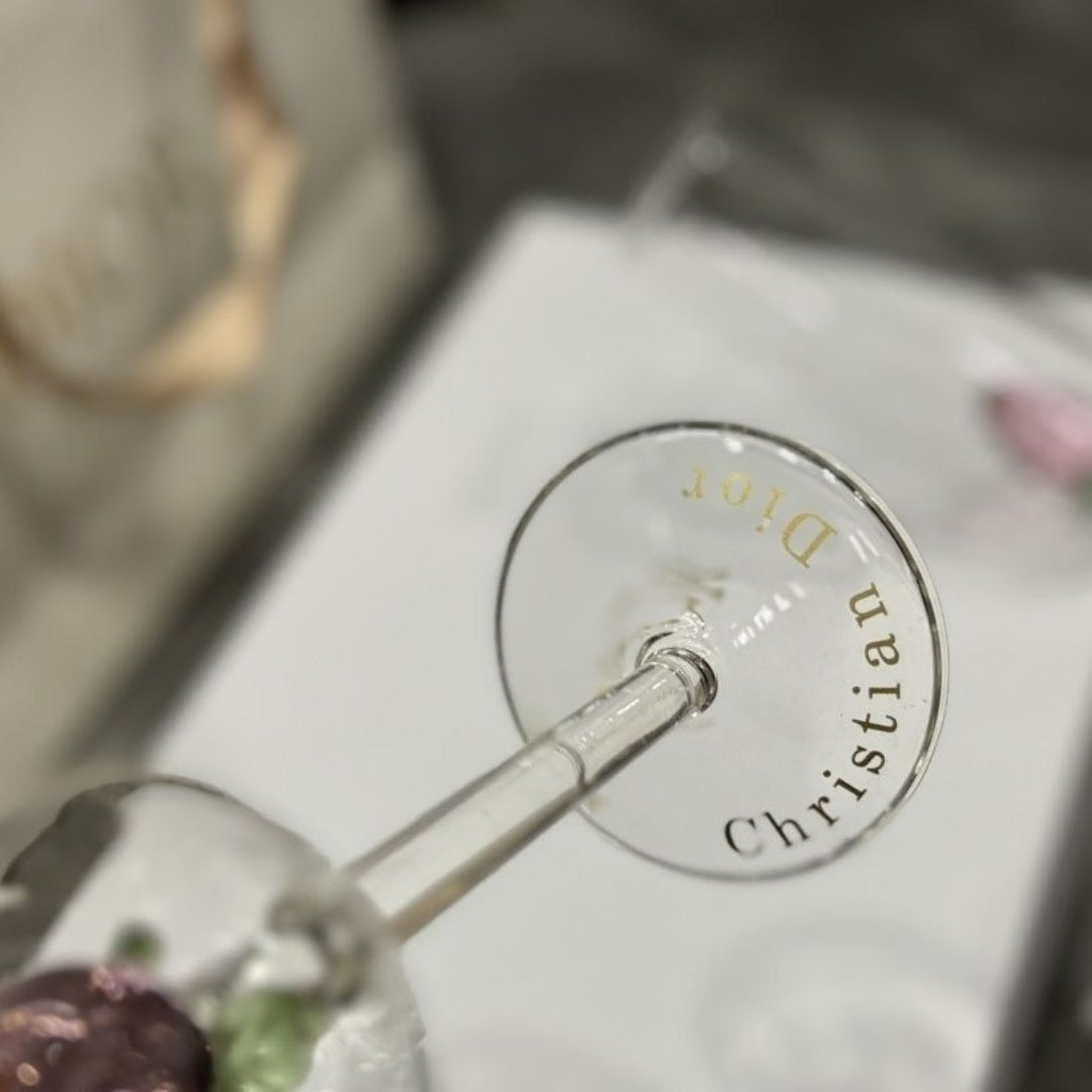 Dior champagne flutes featuring delicate pink rose details