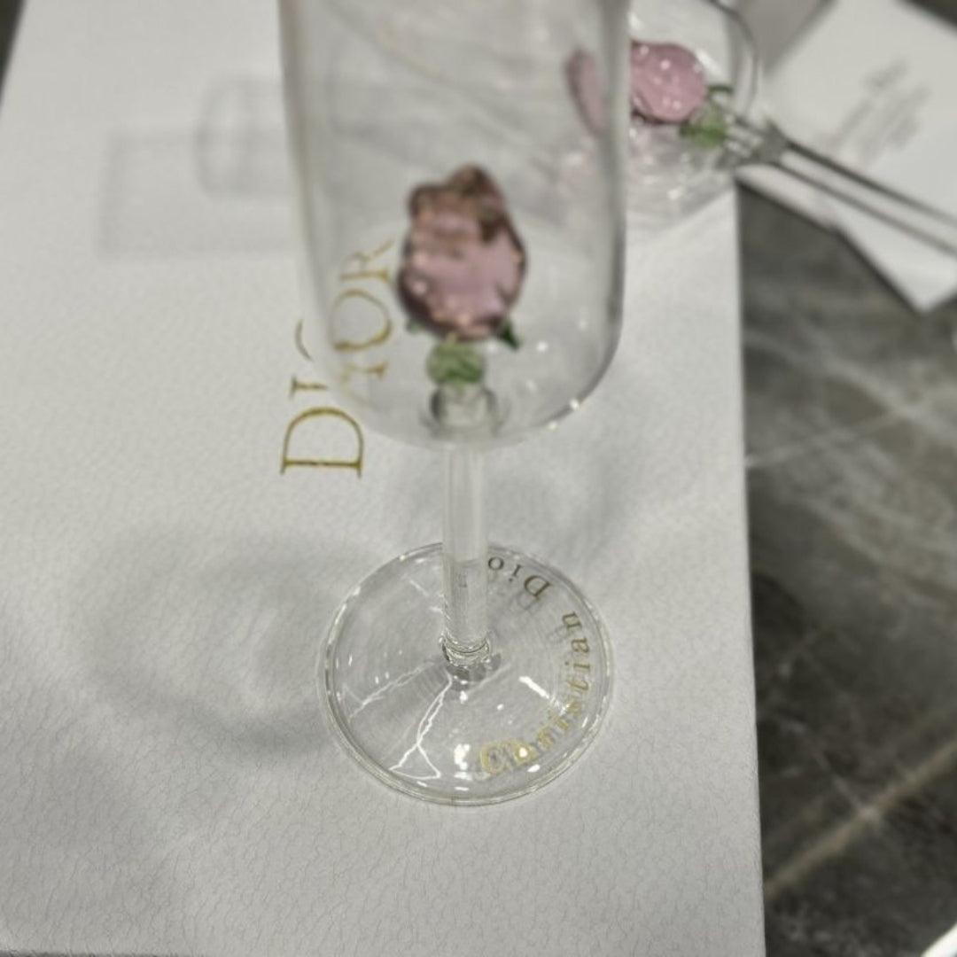 Dior champagne flutes featuring delicate pink rose details